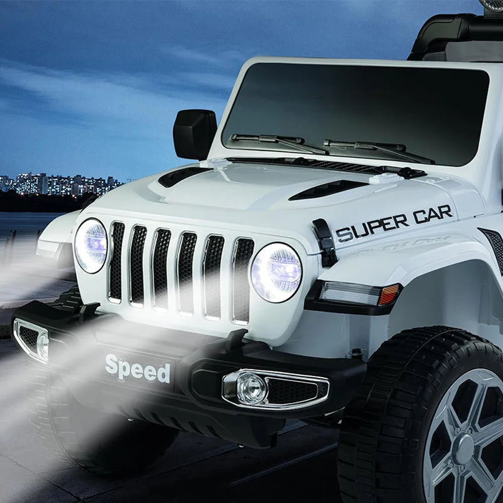 White 12V kids ride-on Jeep Wrangler Rubicon with headlights on, designed for ages 3 to 7 and remote control.