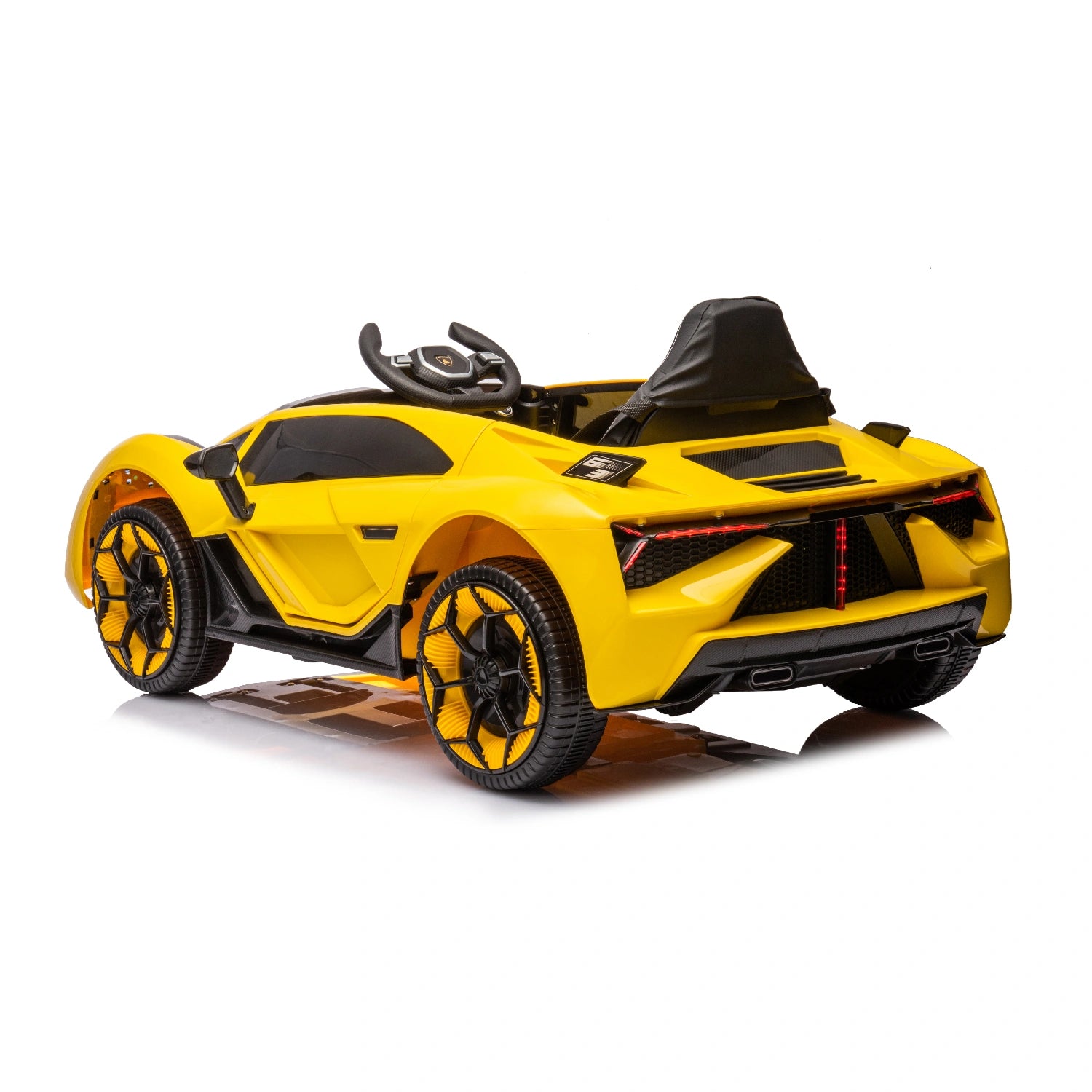 Rear view of yellow 12V Lamborghini-inspired kids ride-on car with black racing seat and detailed wheels