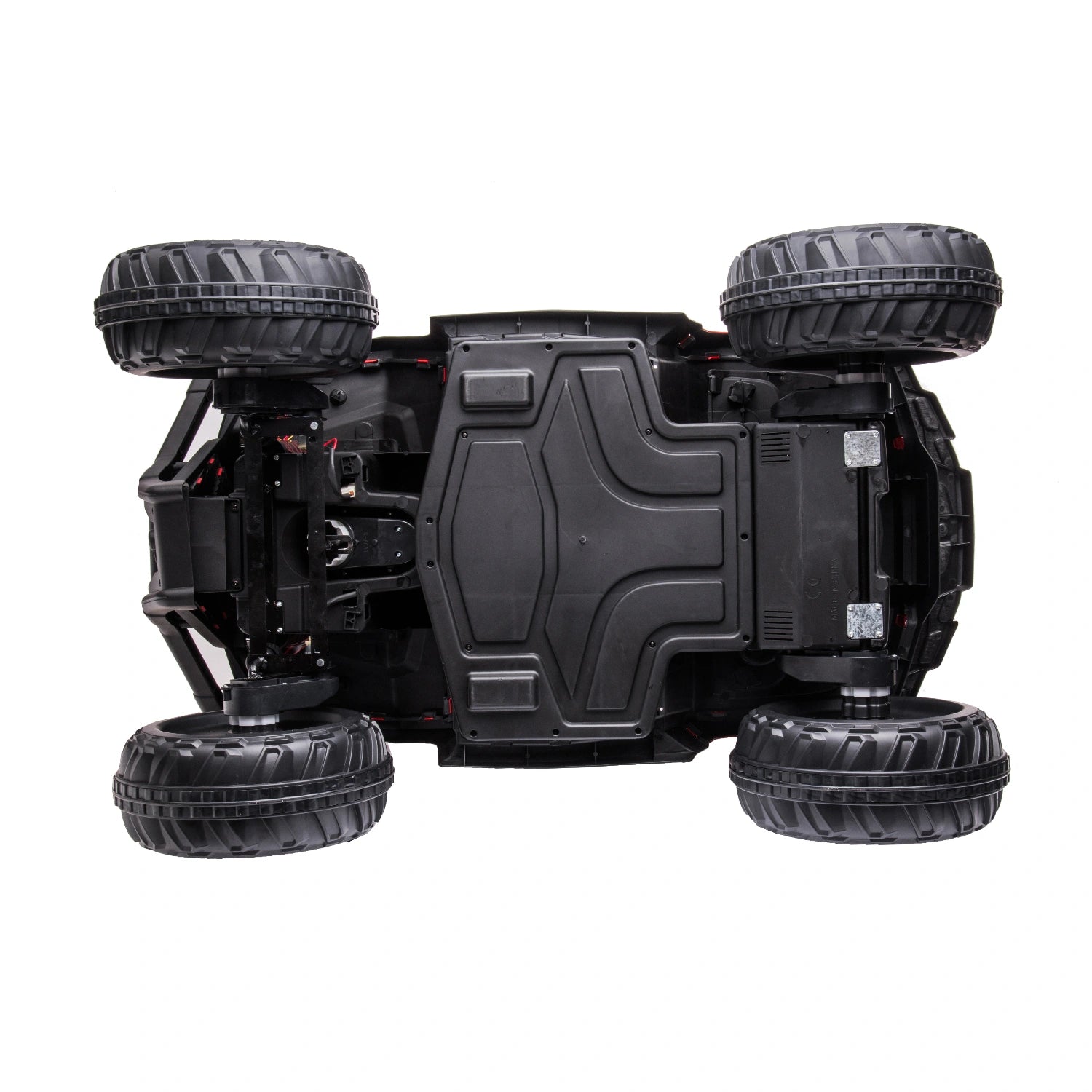 Underside view of black plastic chassis and rugged tires on 12V kids ride-on quad bike ATV with 4WD motors
