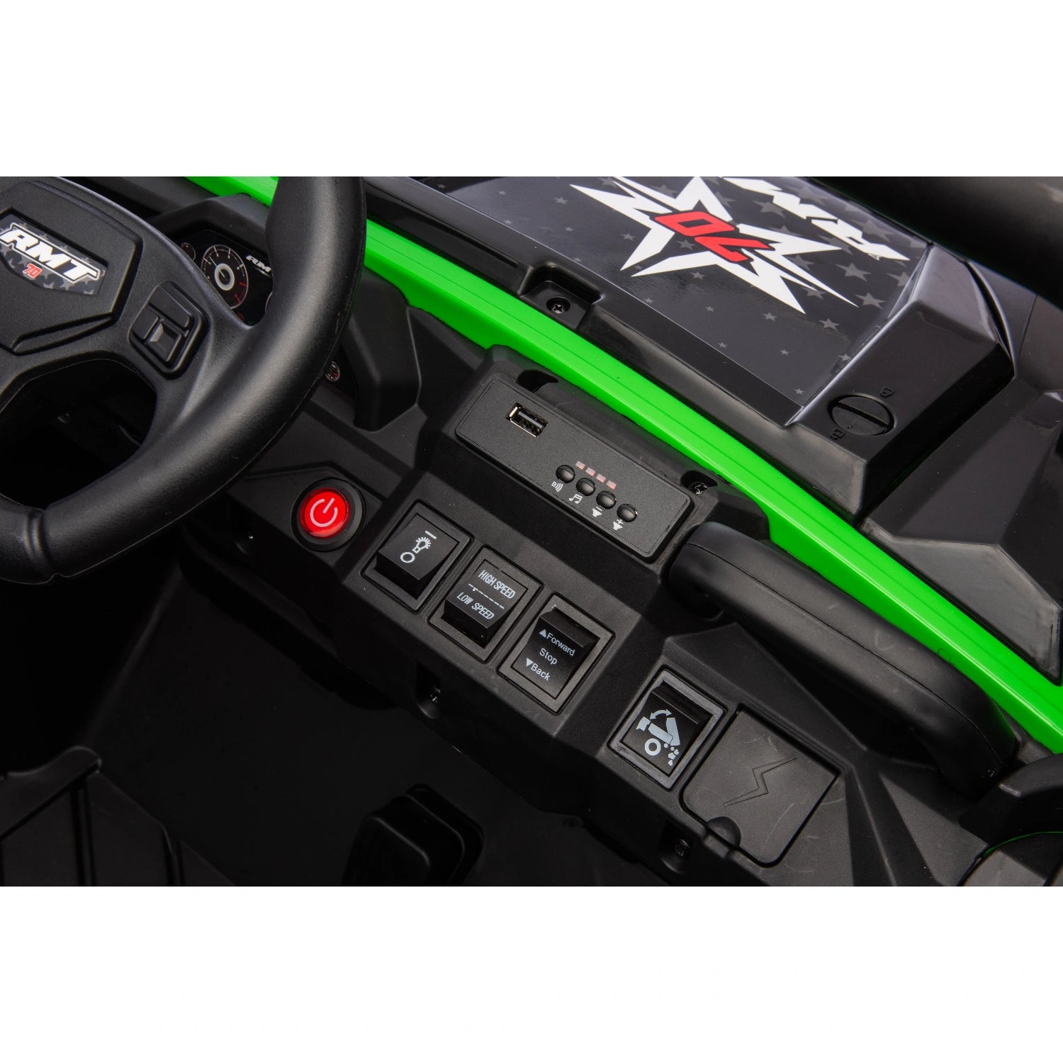 Close-up of black control panel with power button, USB port, switches, and green dashboard on 24V ride-on dump truck