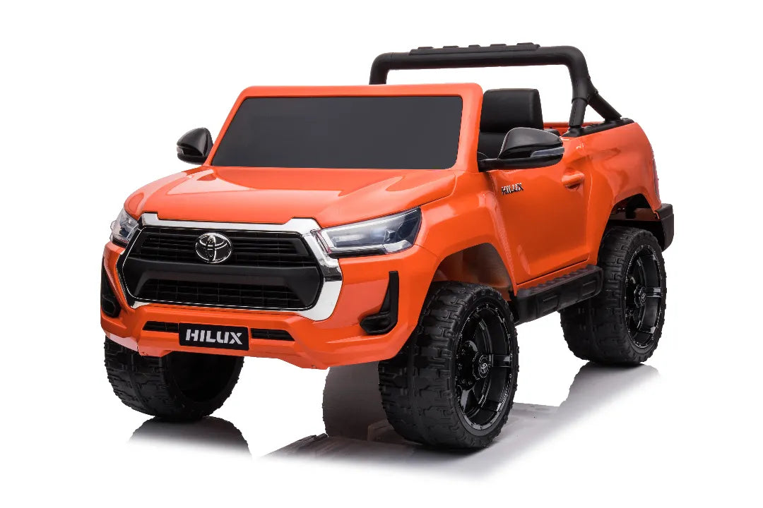 24V licensed orange Toyota Hilux SR5 4x2 kids ride-on ute with black wheels and two-seater design