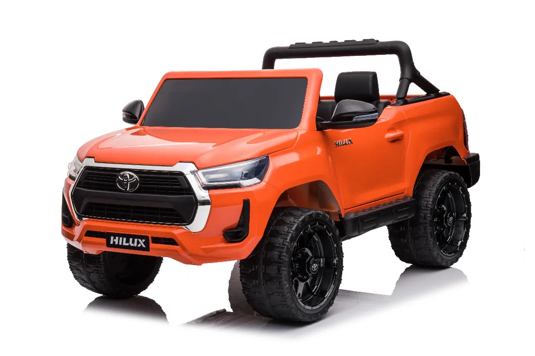 24V orange licensed Toyota Hilux SR5 4x2 2-seater kids ride-on ute with rugged black wheels and roll bar