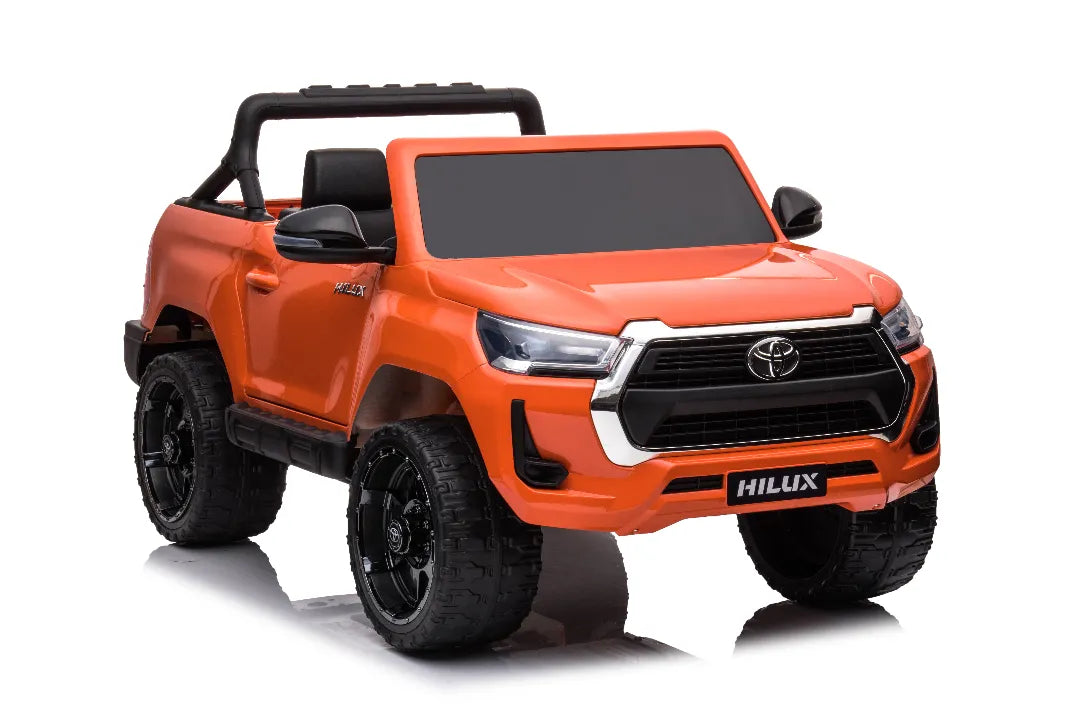 Orange 24V licensed Toyota Hilux SR5 4x2 kids ride-on ute with black wheels and two seats