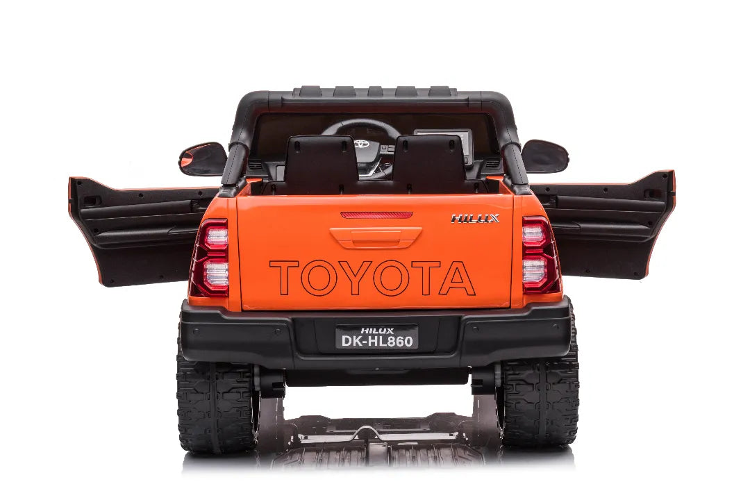Rear view of orange 24V licensed Toyota Hilux SR5 kids ride-on ute with open doors and two black seats