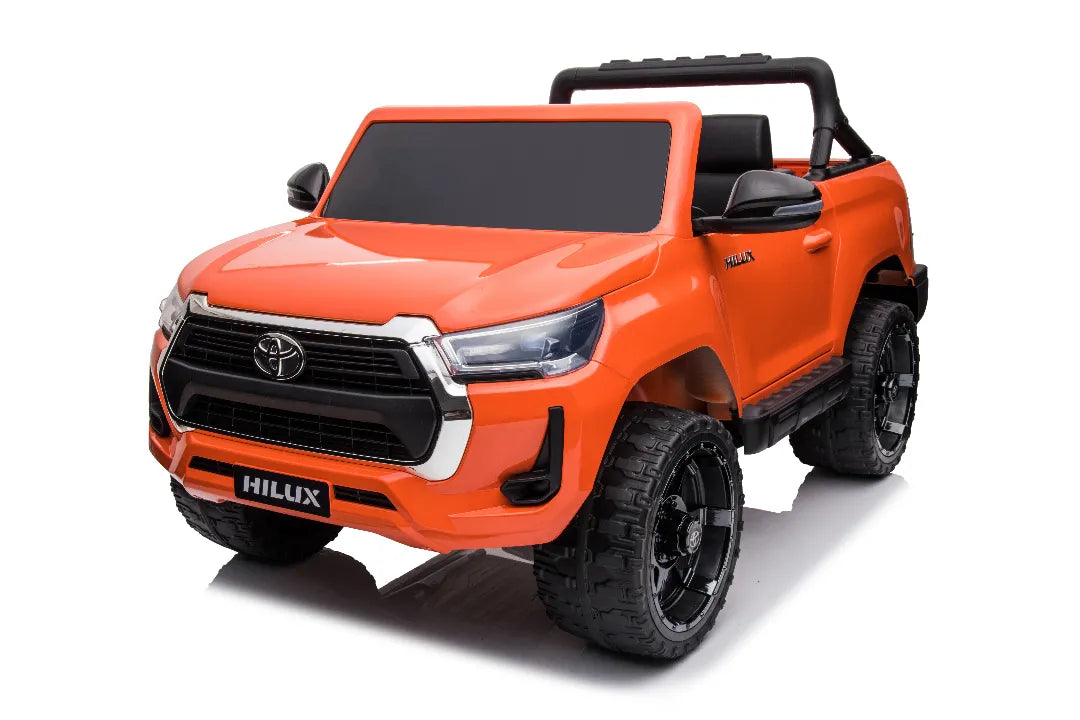 Orange 24V licensed Toyota Hilux SR5 4x2 2-seater kids ride-on ute with black wheels and side mirrors