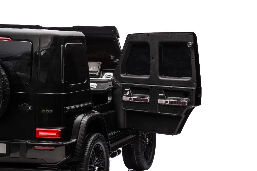 Rear view of black 24V 14Ah licensed Mercedes-AMG G63 kids ride-on car with open door and detailed interior panel