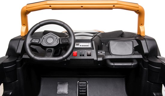 Interior dashboard and steering wheel of the Stinger Buggy XL 24V 4x4 kids ride-on car in gold color.