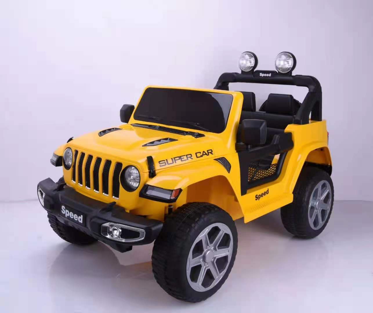 Yellow Jeep Wrangler inspired 4WD electric ride-on toy car for kids aged 3 to 7 with remote control.