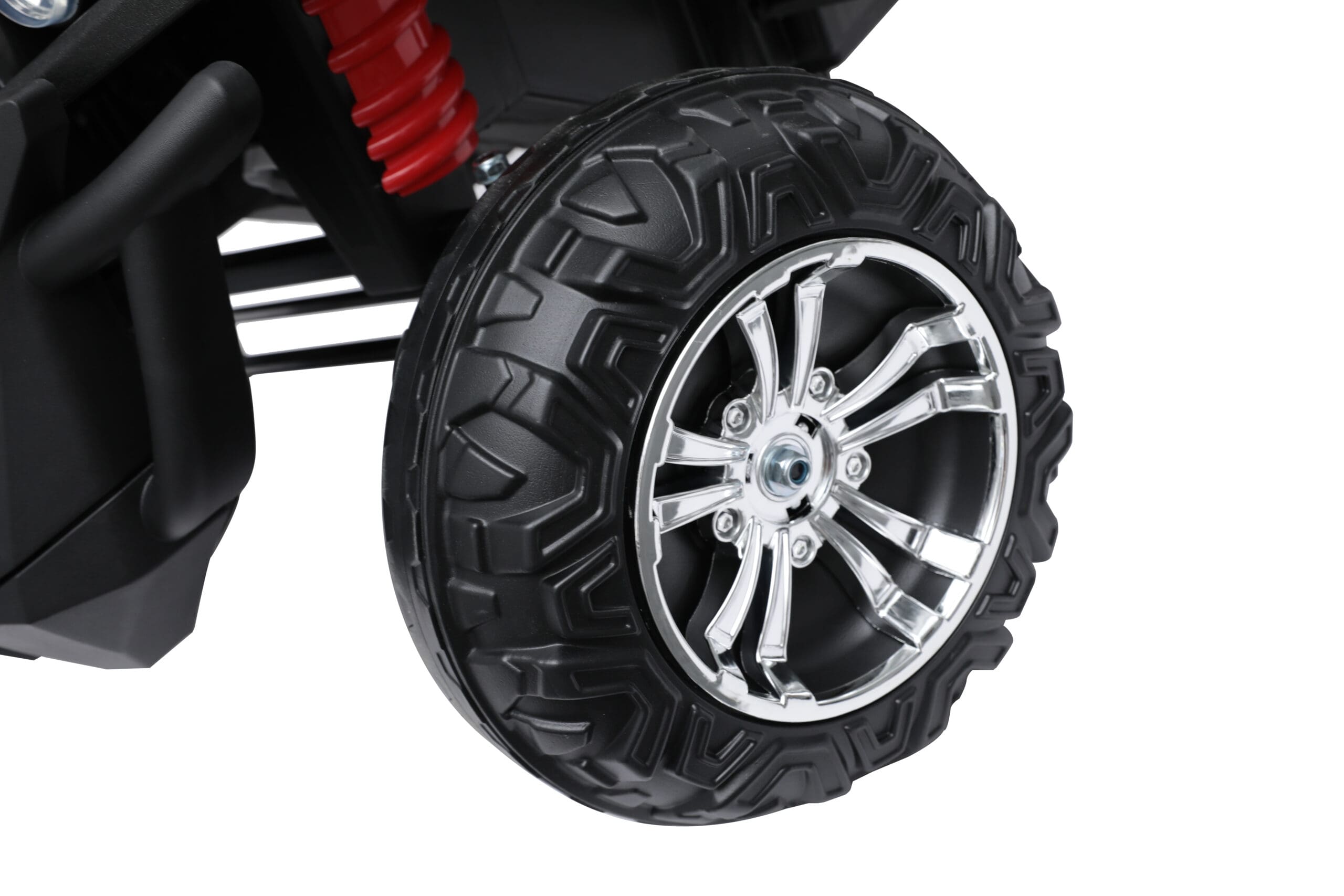 Close-up of large soft EVA tire with chrome rim on red 24V Mc Wholesalers Beach Buggy Speed electric ride-on toy for kids
