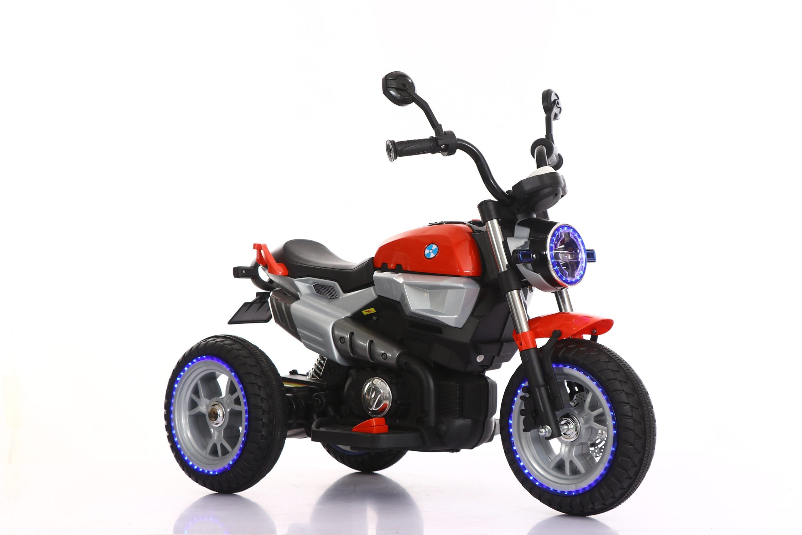 12V battery-powered kids motorcycle with LED lights, three wheels, and push-button ignition for ages 3 to 7 years.