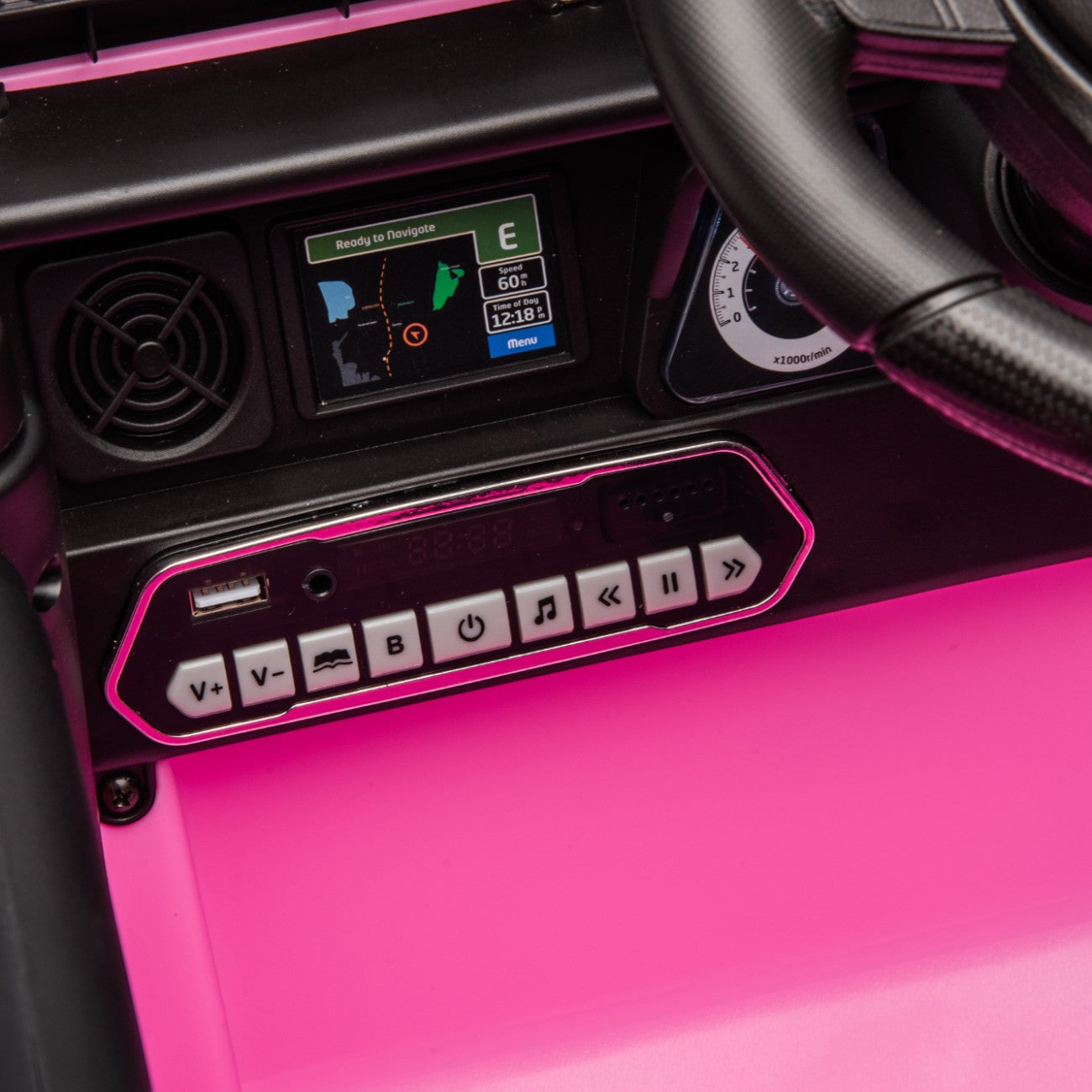 Close-up of pink Toyota FJ Cruiser toy car dashboard with functional buttons and digital display panel.