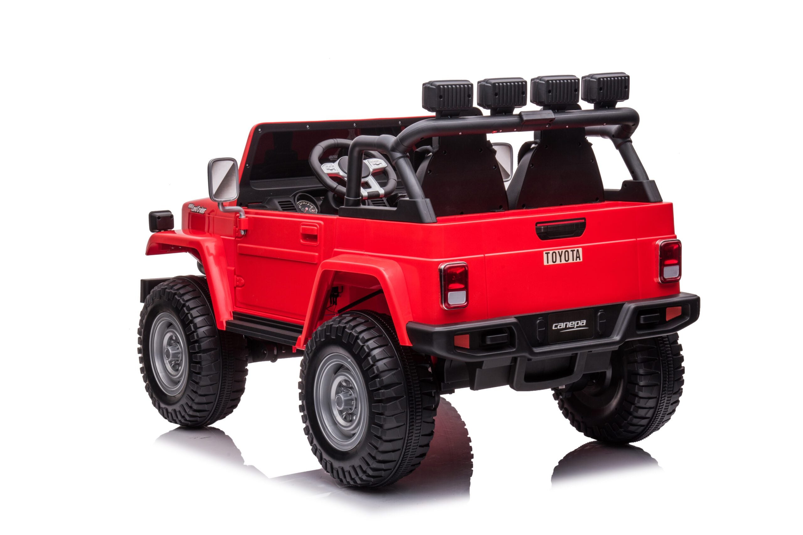 Red 24V 4WD Toyota FJ-40 kids ride-on electric car with two seats and off-road tires viewed from rear angle.
