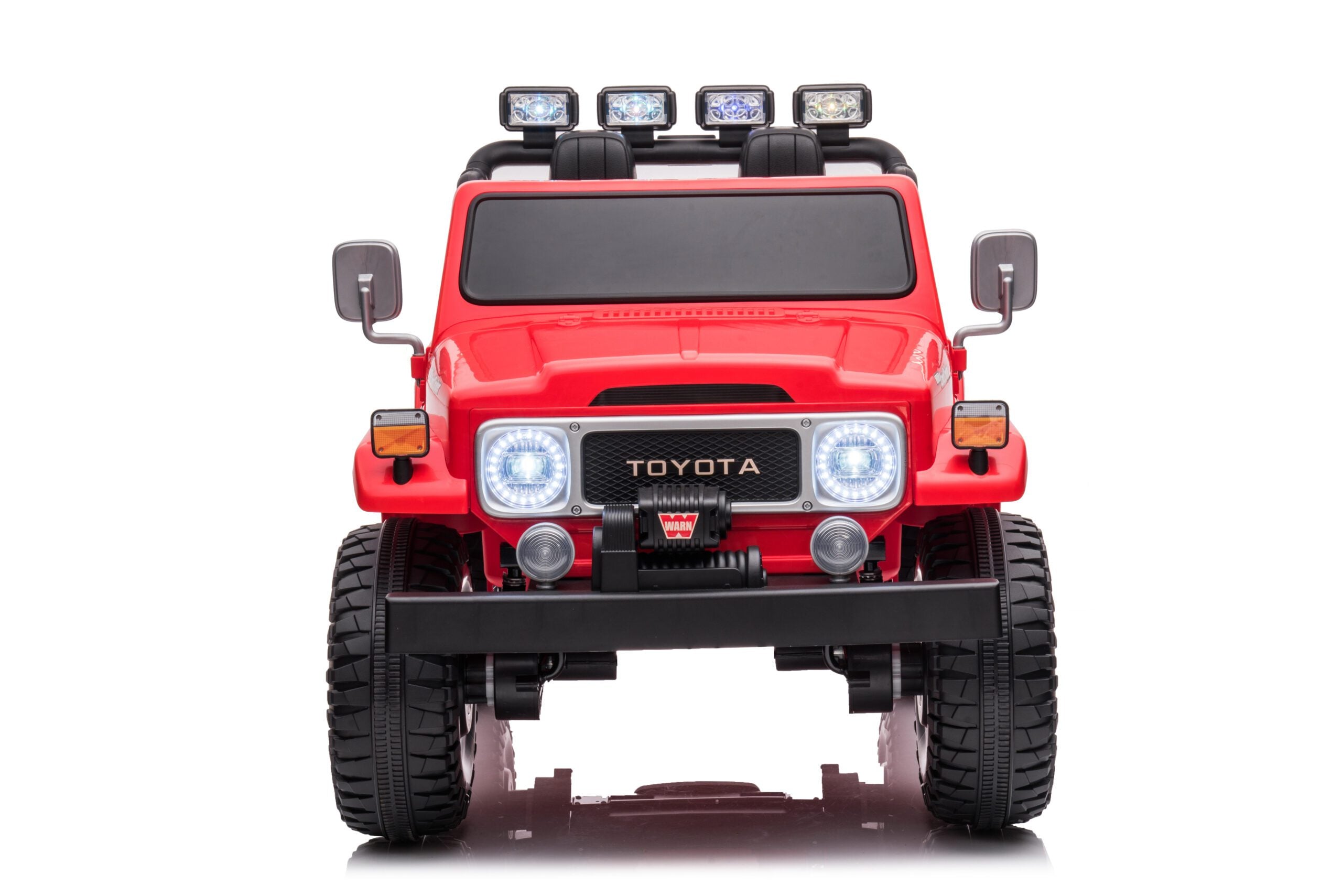 Front view of red 24V 4WD Licensed Toyota FJ-40 SUV kids electric ride-on car with headlights on