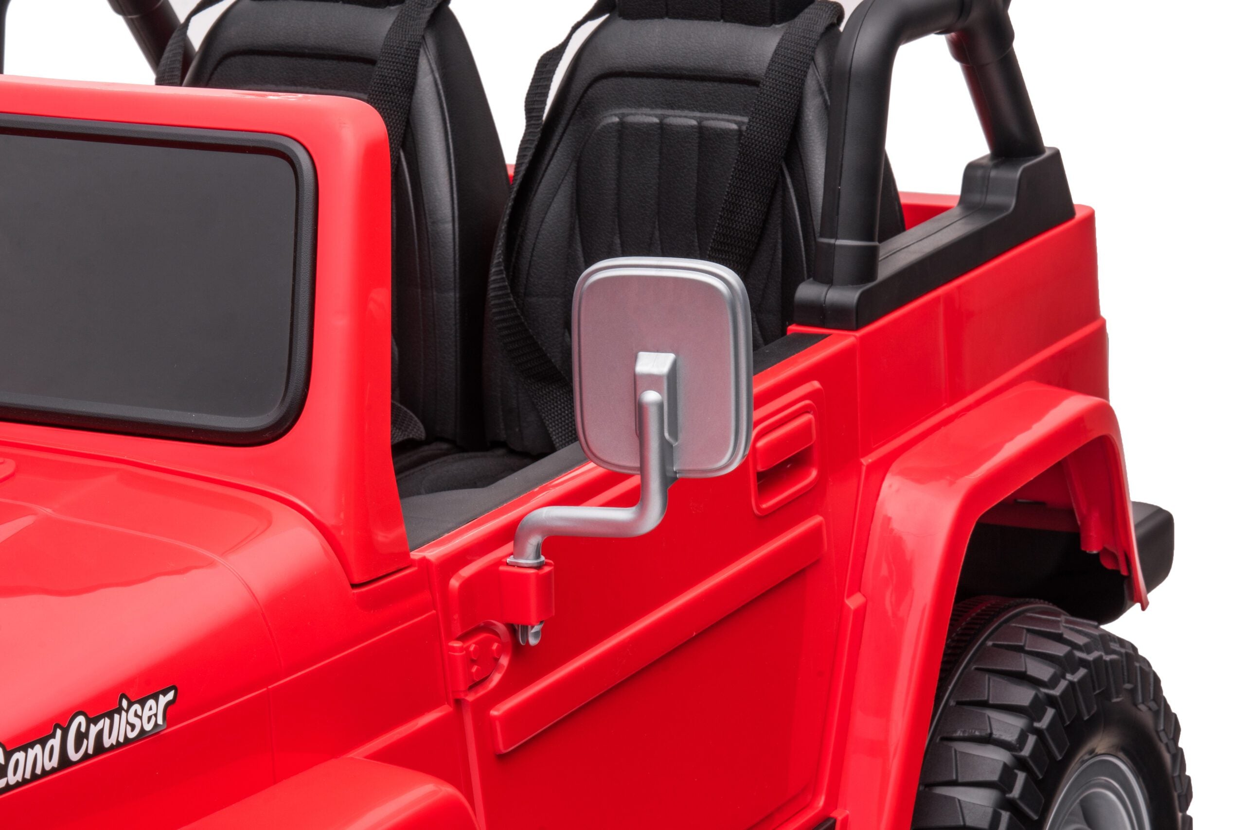 Close-up of red 24V 4WD Toyota FJ-40 kids ride-on electric car showing black seats and side mirror detail