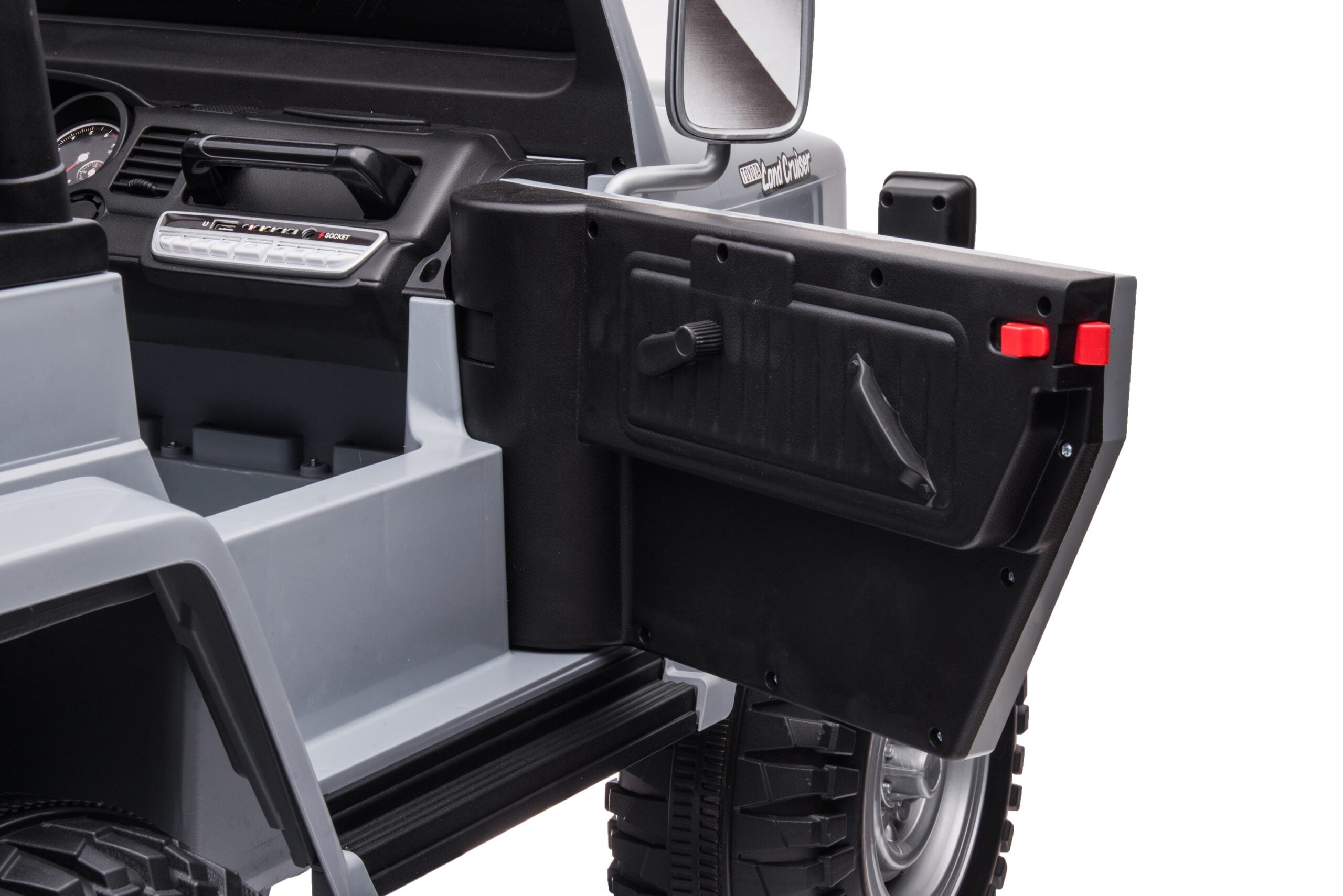 Close-up of the open door and interior details of a black 24V Toyota FJ-40 kids electric ride-on SUV car.