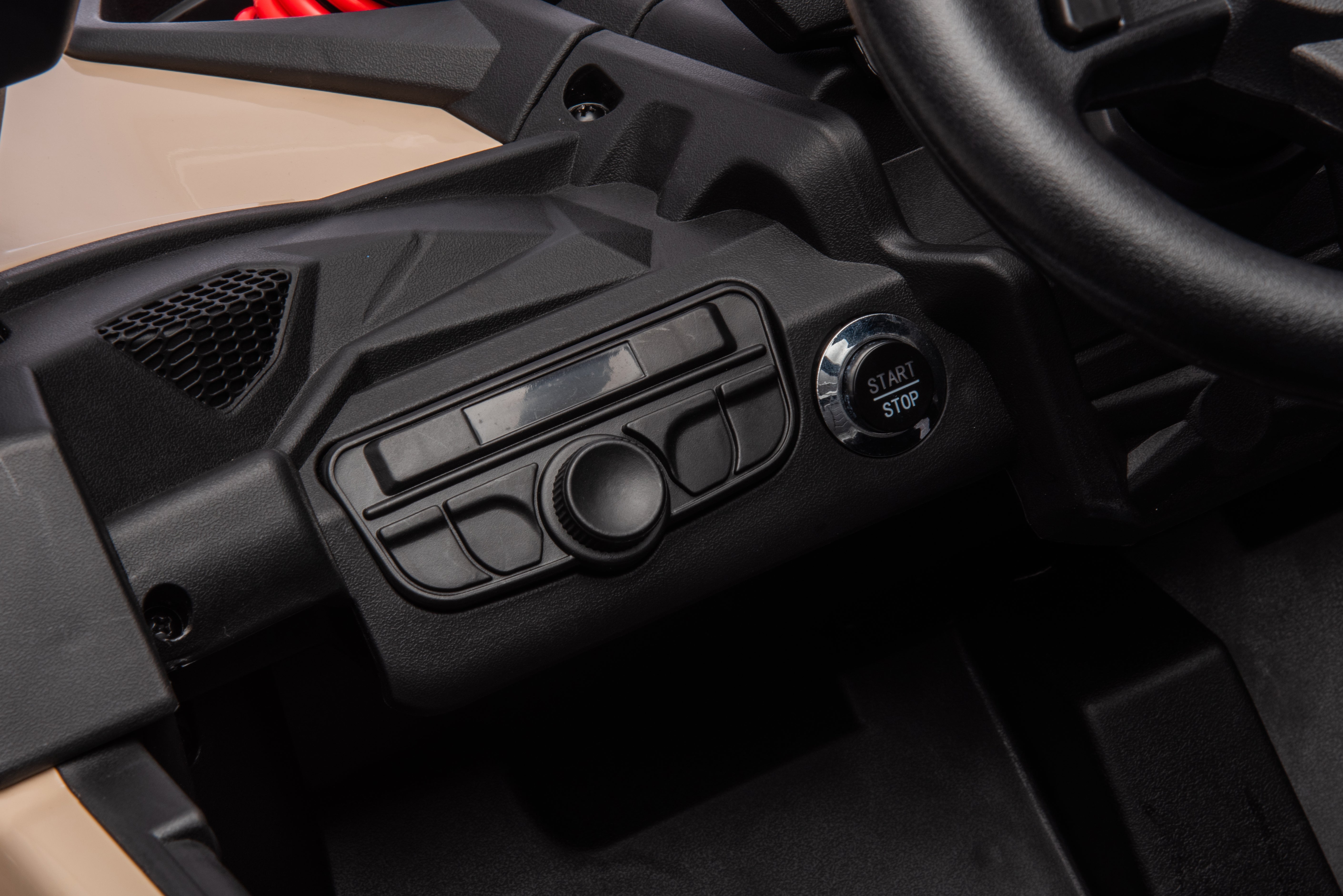 Close-up of the dashboard and start-stop button on the Can-Am Maverick 800W 24V kids ride-on UTV in Barbie pink.