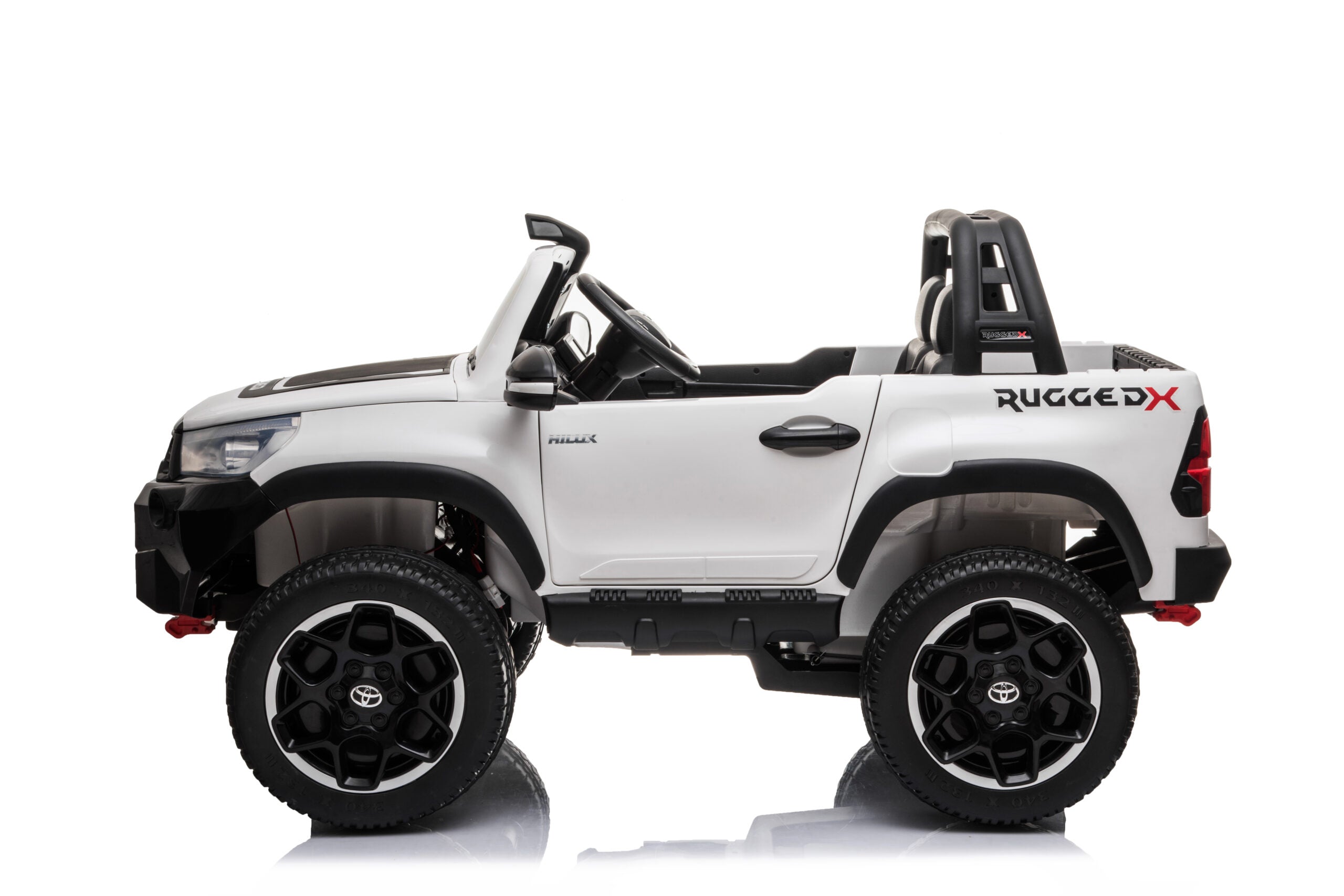 White 24v ride-on Toyota Hilux 4WD toy car with realistic details, large tires, and open-top design for kids.
