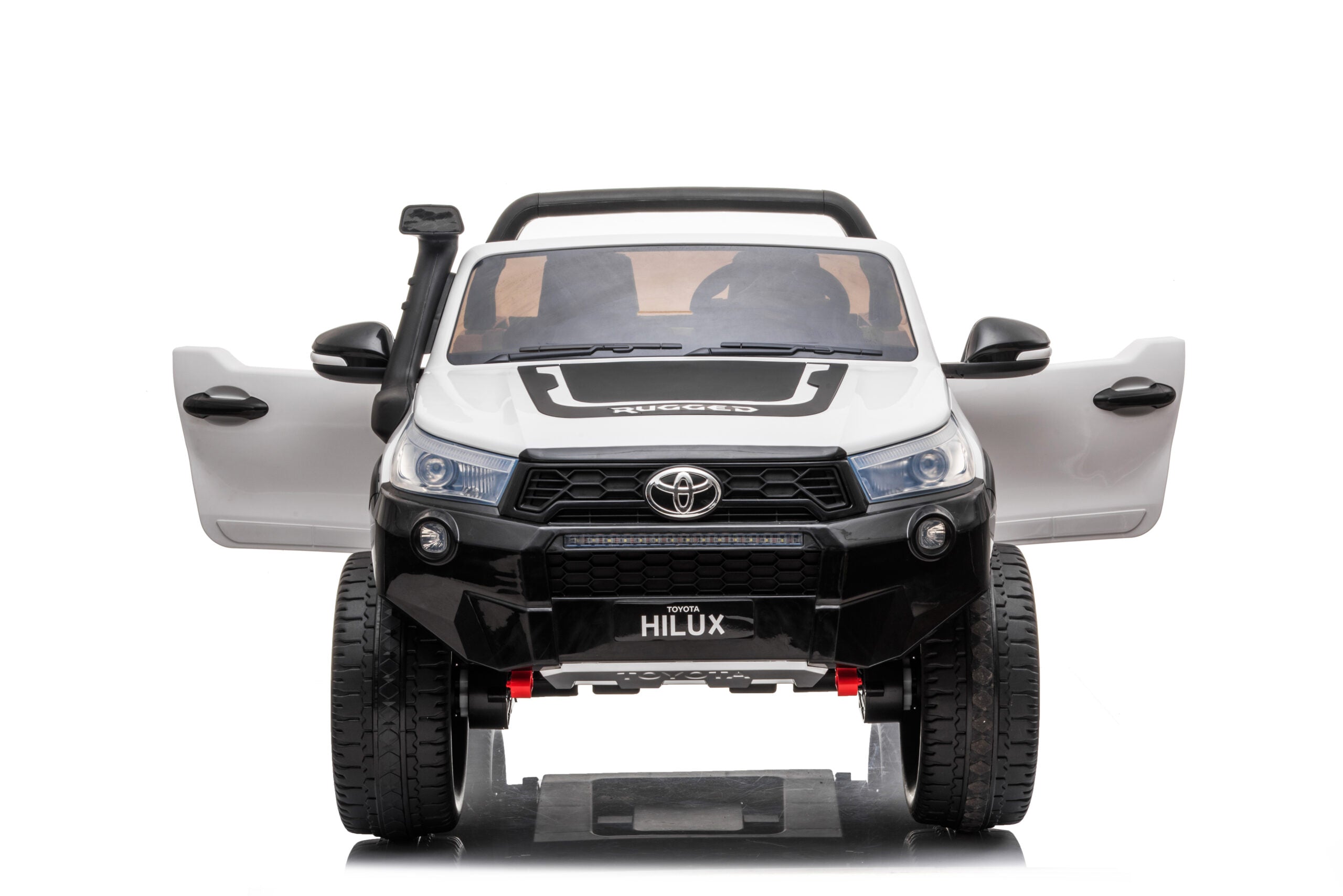 White 24V Toyota Hilux 4WD ride-on car for kids with opening doors and realistic details front view.