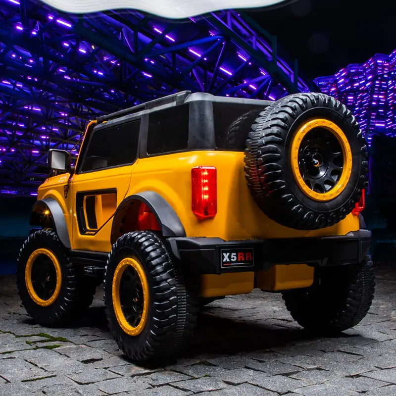 Yellow ride-on Jeep Beyond 12V 4WD SUV for kids with remote control, large tires, and realistic design details.