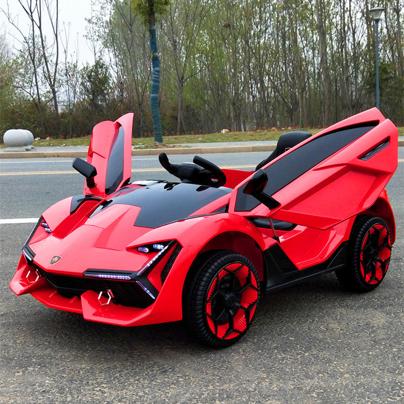 Red 12V Lamborghini-inspired kids electric ride-on car with open scissor doors and black accents on road.