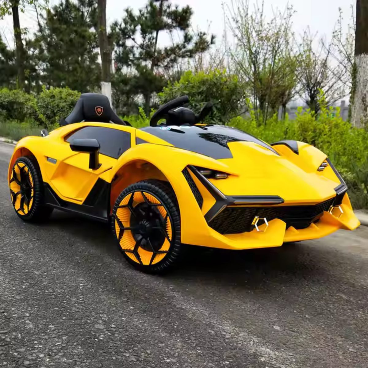 Yellow 12V Lamborghini inspired kids ride-on electric car with remote control and realistic design on driveway outdoors