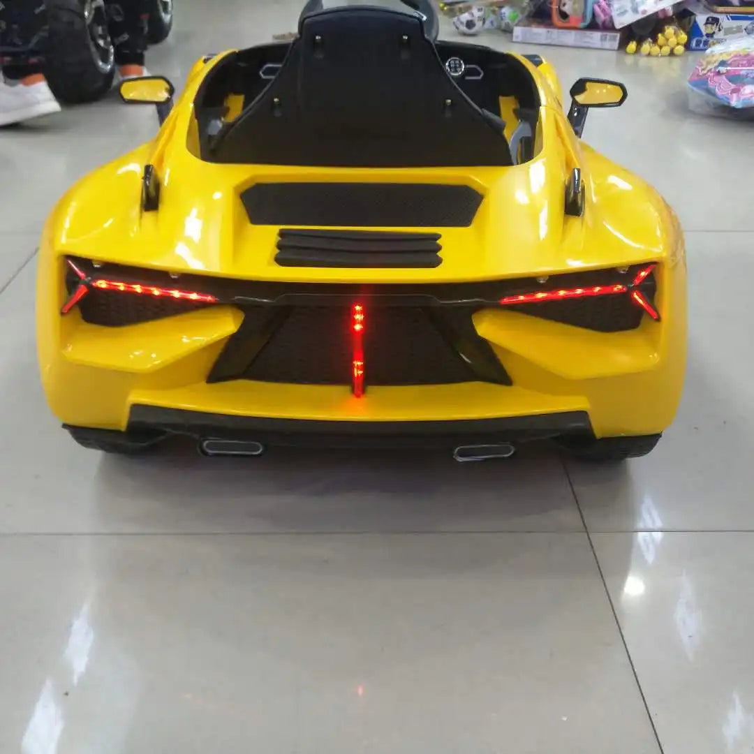 Yellow Lamborghini inspired 12V kids electric ride-on car with sporty rear lights and single seat visible from back view.