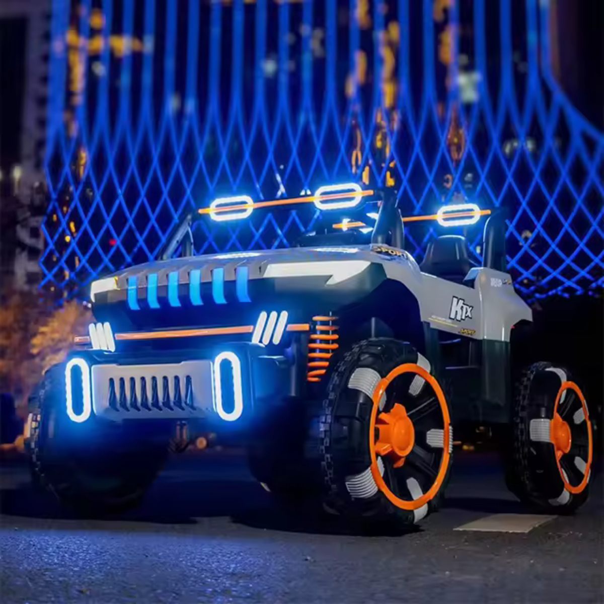 Grey 24V 2-seater UTV ride-on buggy for kids with Bluetooth, remote control, LED lights, and off-road tires at night.