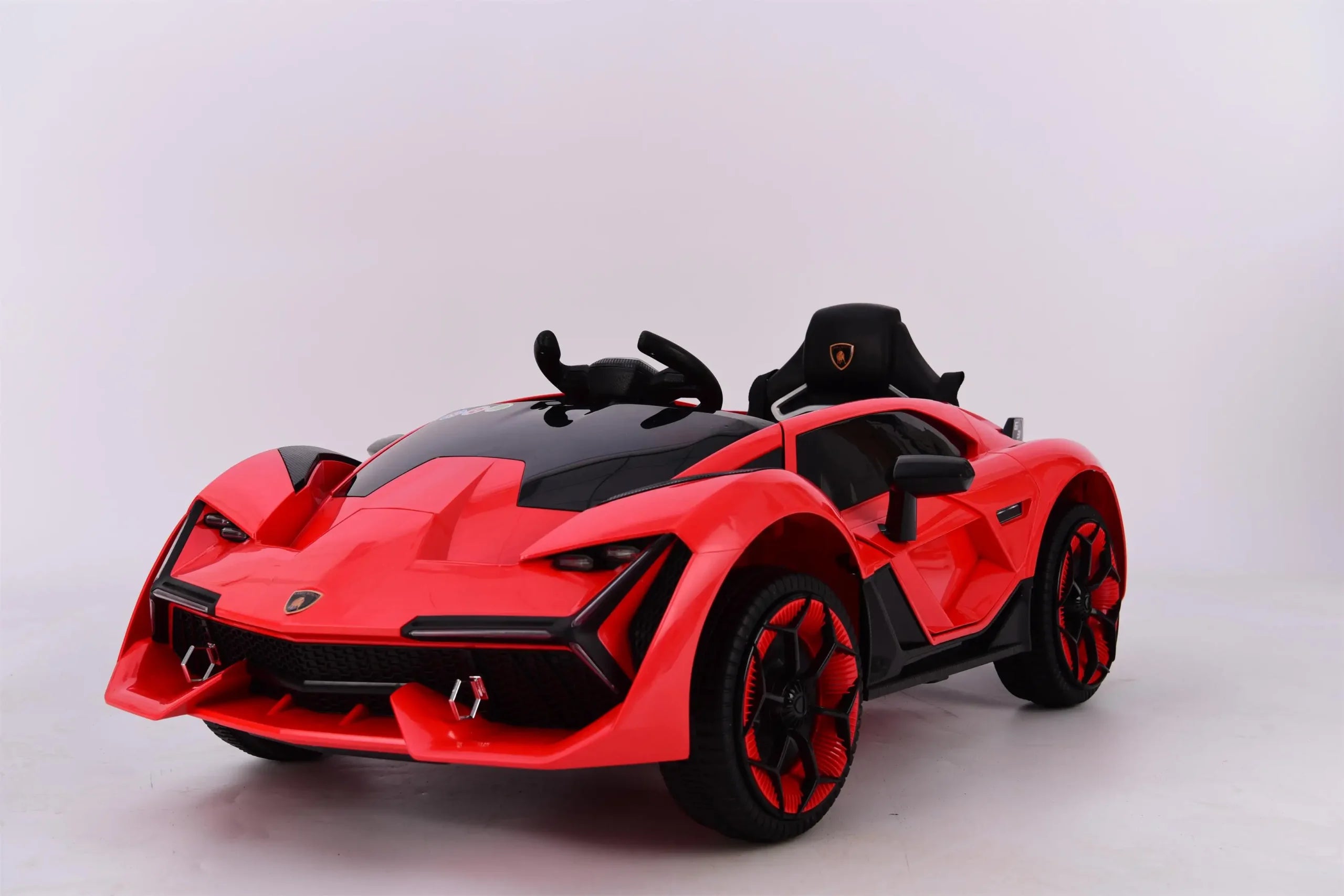 Red 12V Lamborghini style electric ride-on car for kids with black detailing and sporty design, single seat and plastic tires.