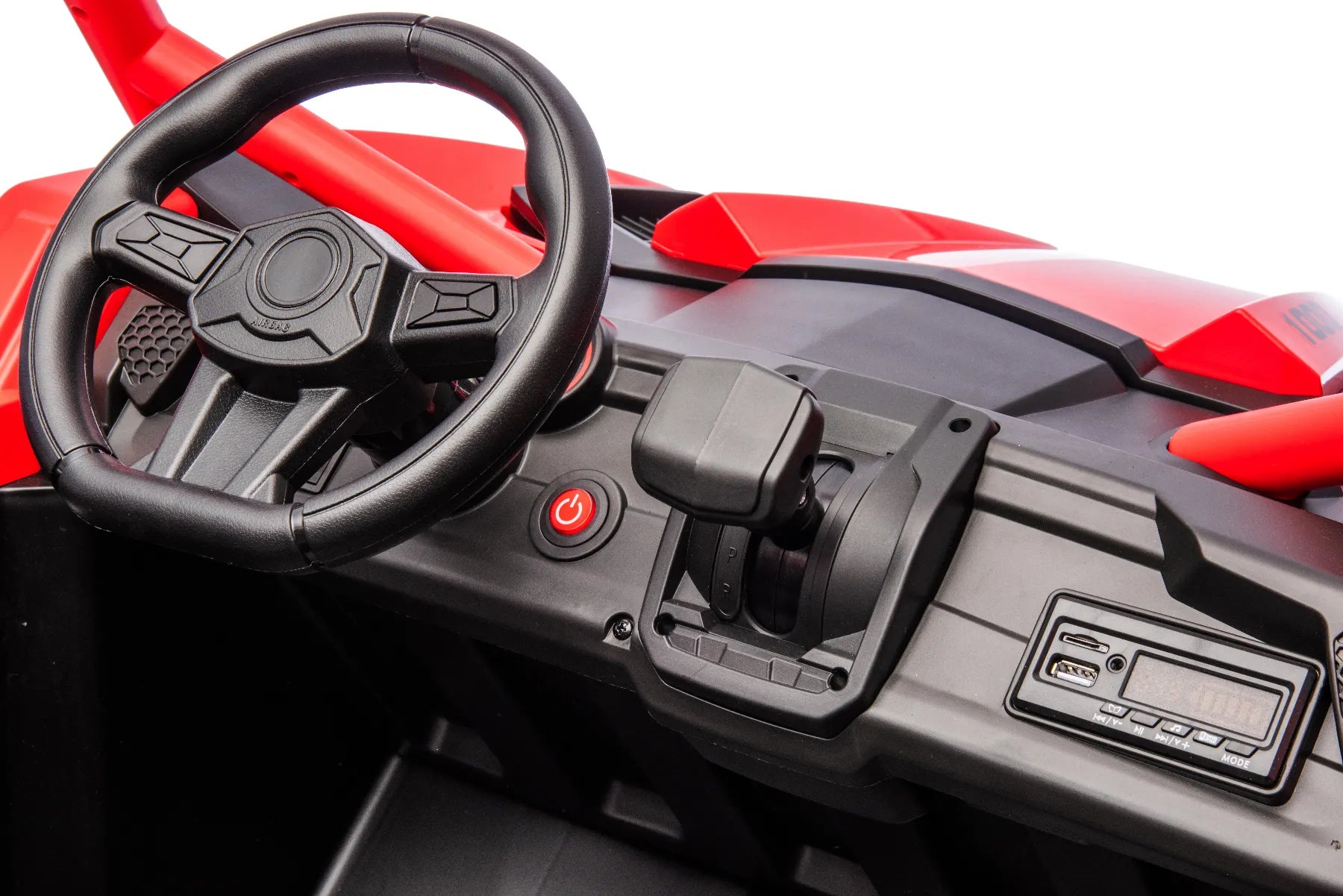 Close-up of black steering wheel, power button, gear lever, and dashboard controls on red 2-seater 24V kids ride-on buggy