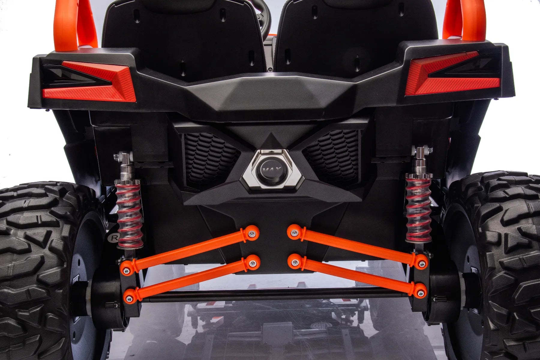 Rear view close-up of orange 24V 1400W King of UTVs ZForce RZR Turbo 2-seater ride-on buggy suspension and tires