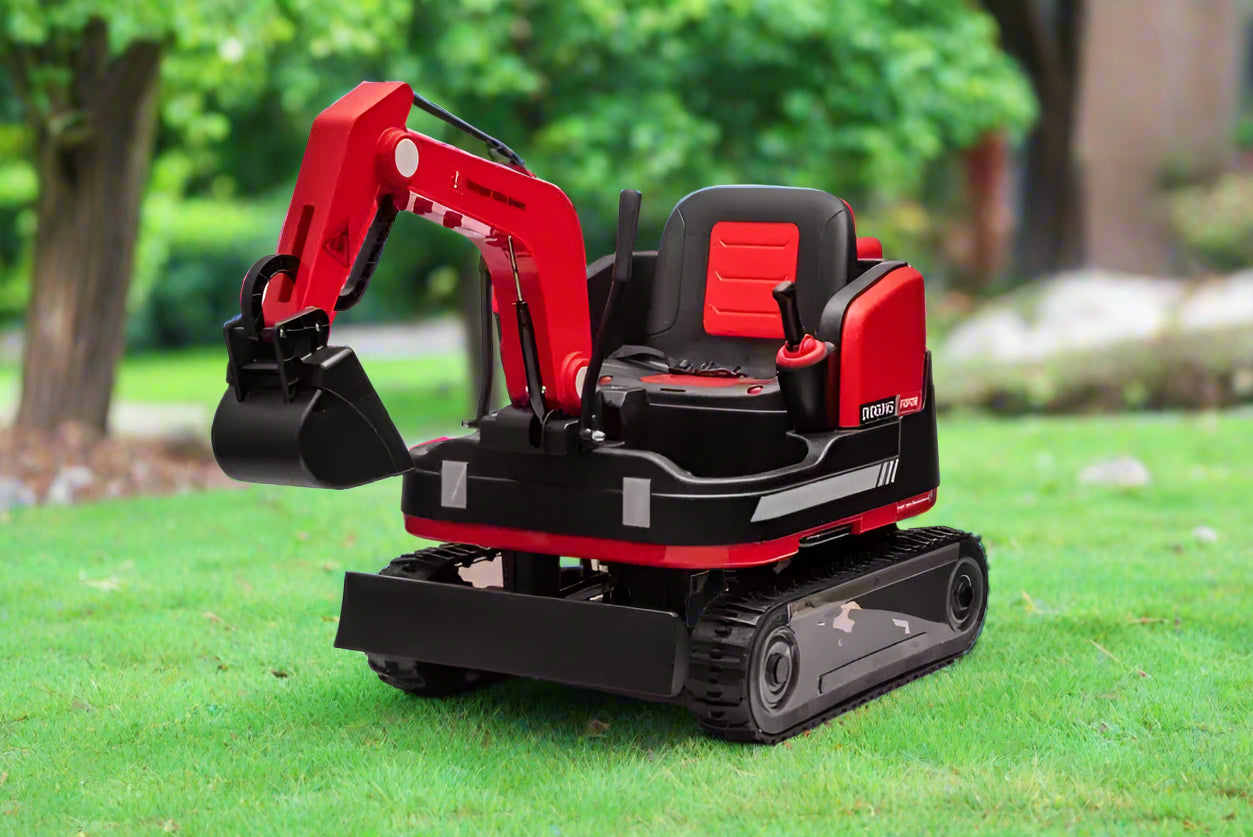 Red 24V kids ride-on excavator toy with manual digger arm, dual motors, and secure seatbelt on grassy surface outdoors.