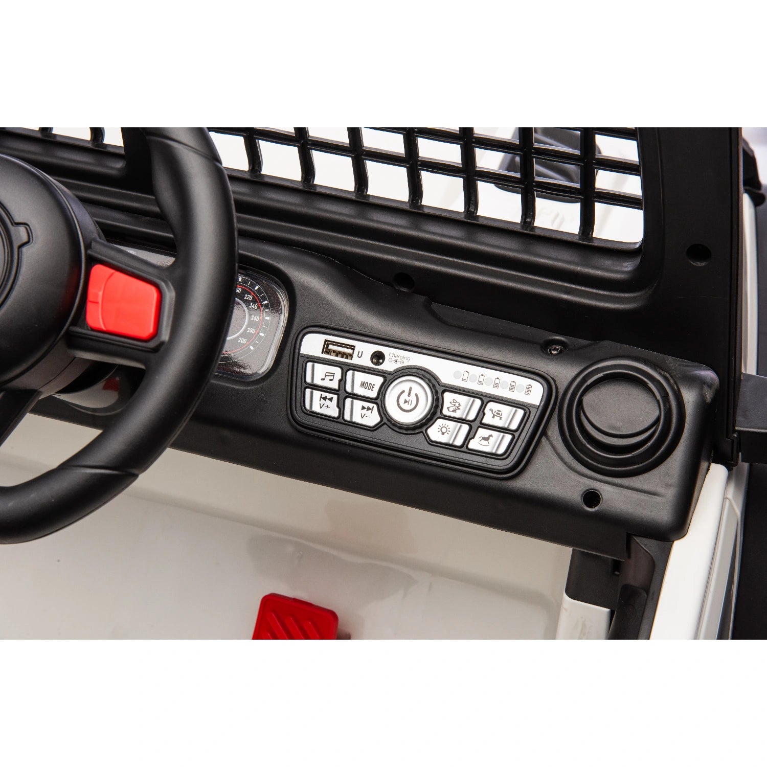 Close-up of black dashboard and steering wheel with control buttons on white 12V ride-on jeep for kids