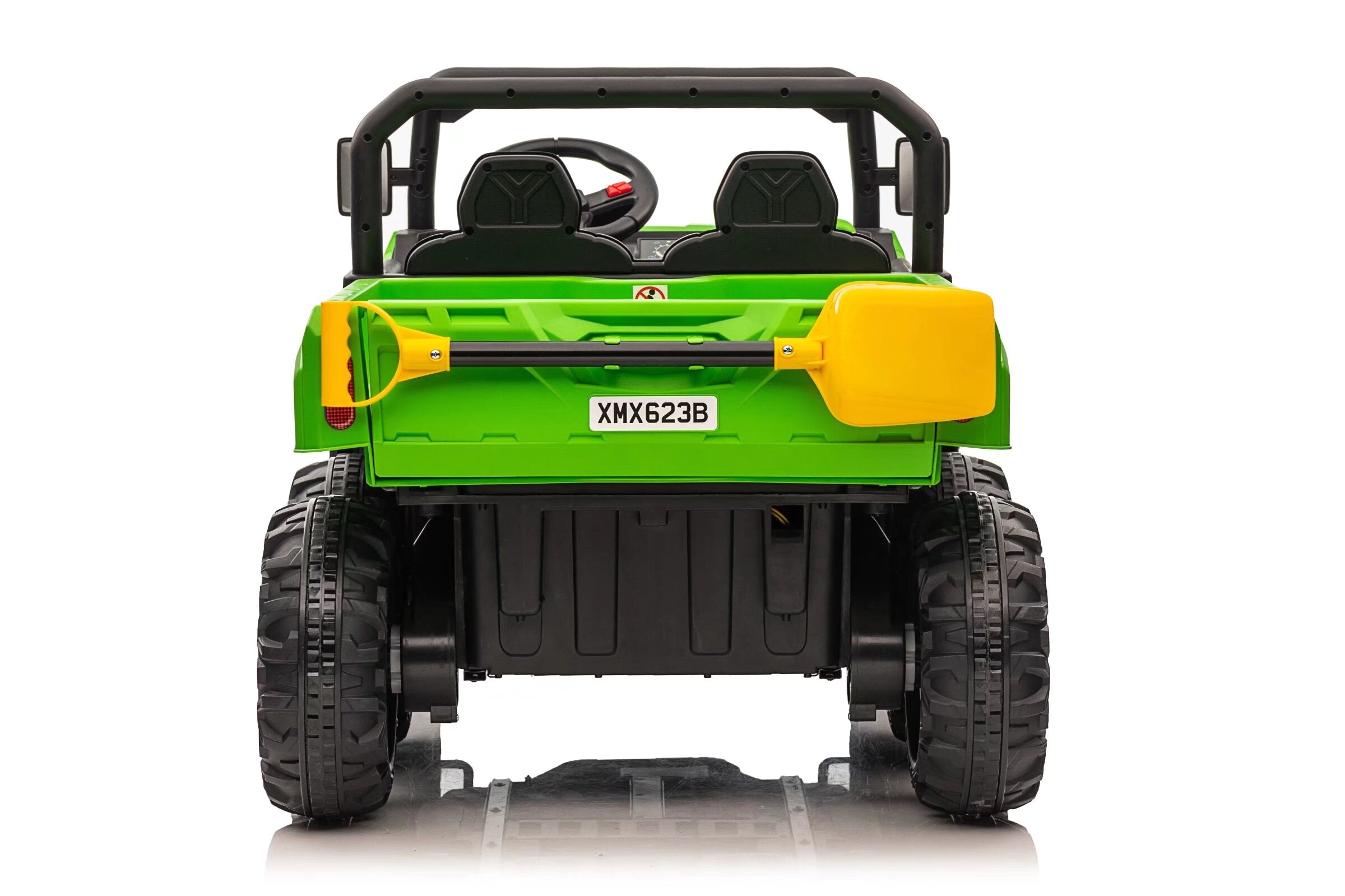 Rear view of green 24V electric ride-on dump truck for kids with dual seats and six large wheels.