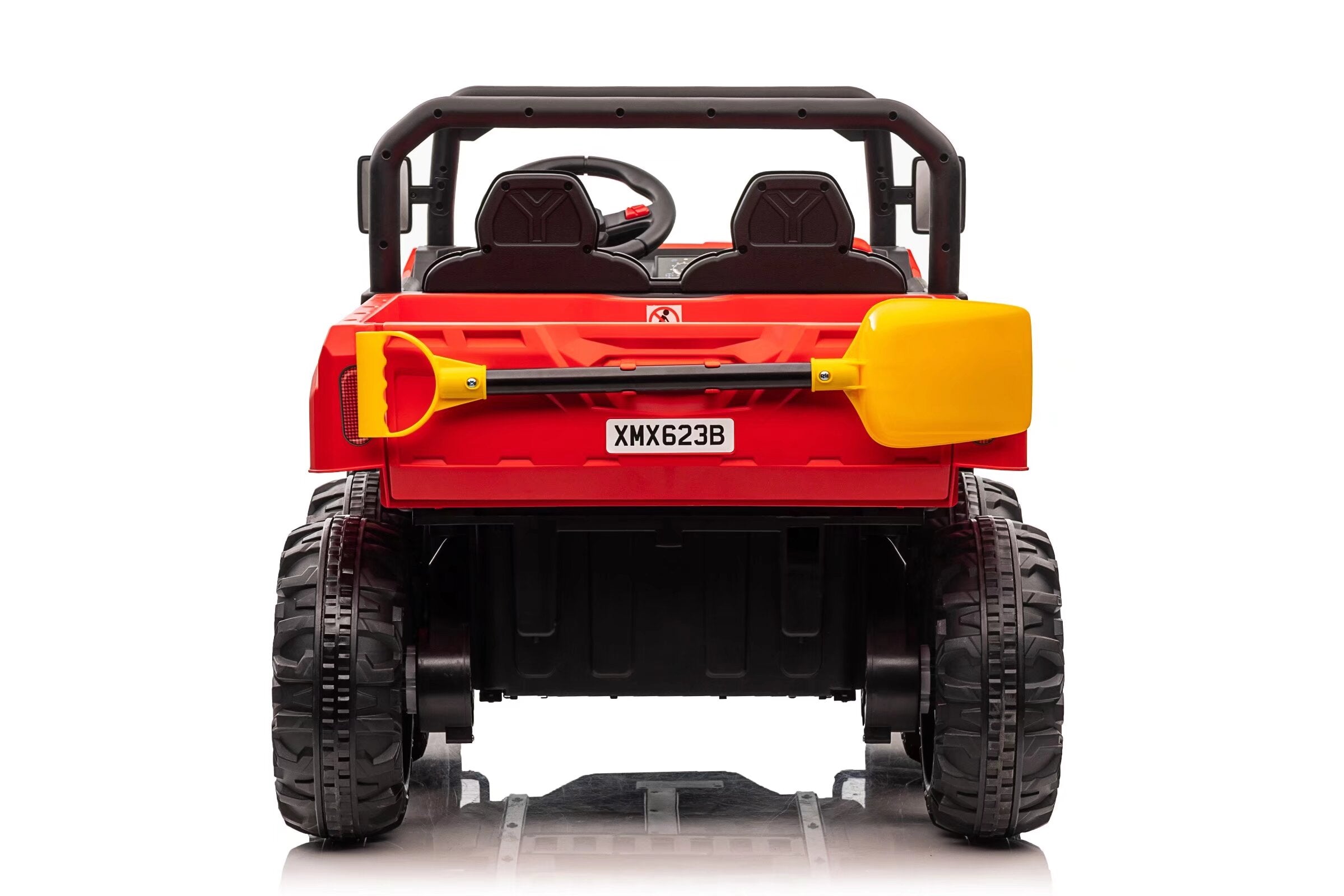 Rear view of red 24V electric ride-on dump truck for kids with dual seats and yellow shovel attached