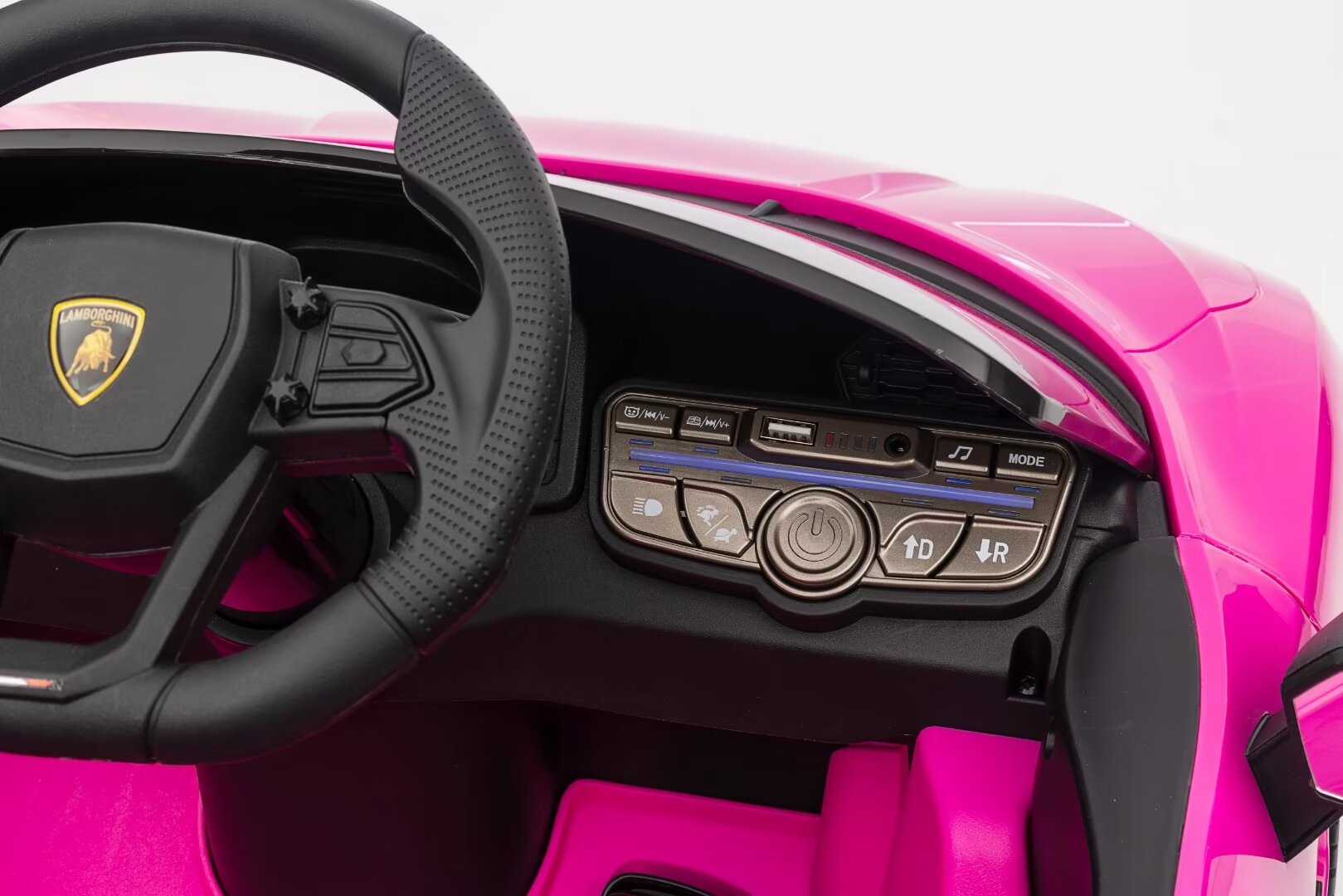 Dashboard and steering wheel of a pink Lamborghini Revuelto 12V licensed electric ride-on car for kids