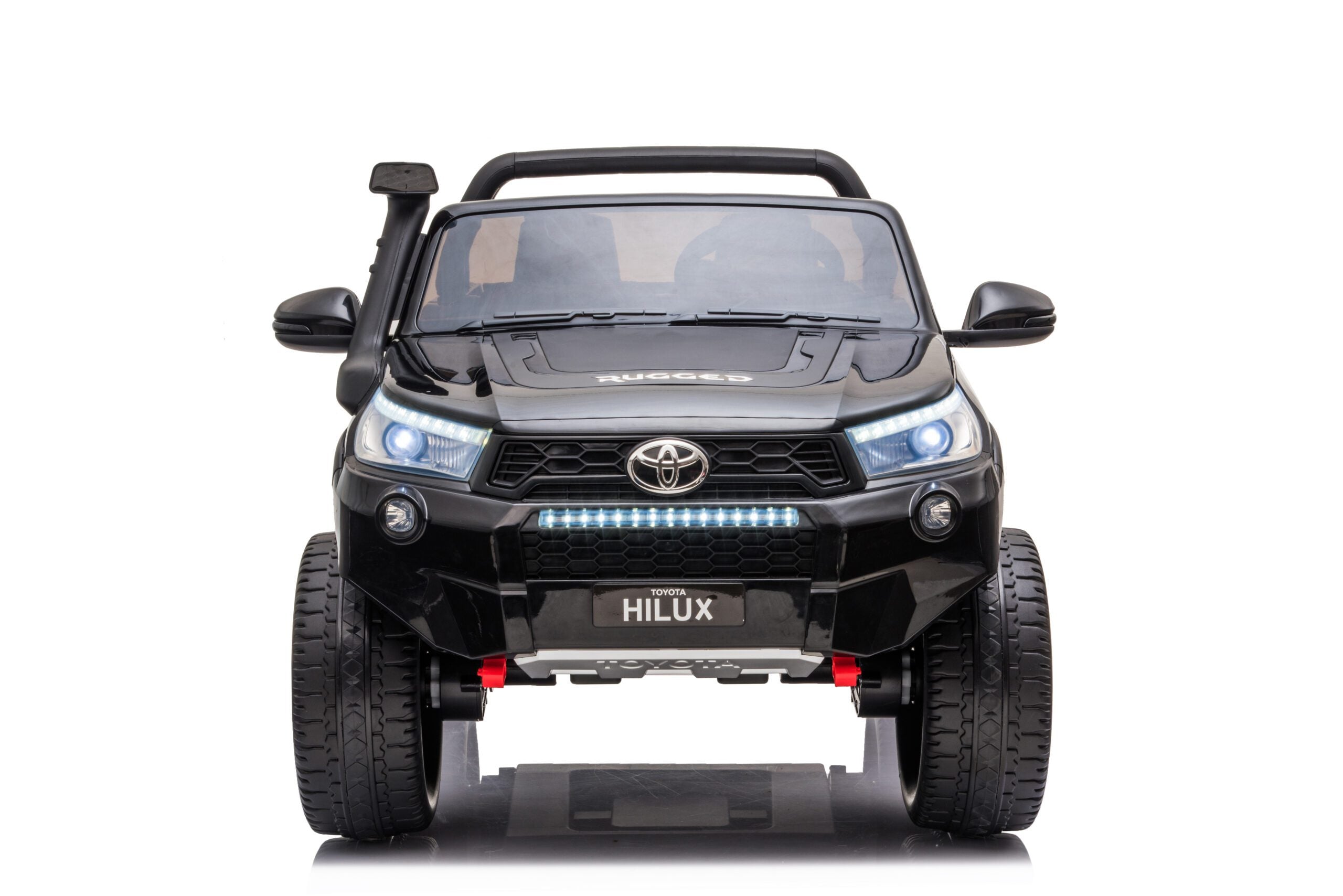 Front view of black 24V Toyota Hilux 4WD ride-on electric car with LED lights and rugged tires for kids.
