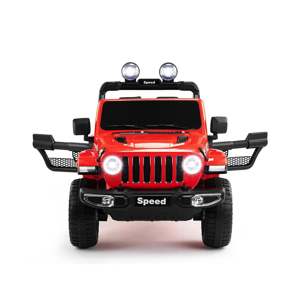 Red 12V kids ride-on Jeep Wrangler with open doors, headlights on, and off-road style lights on roof