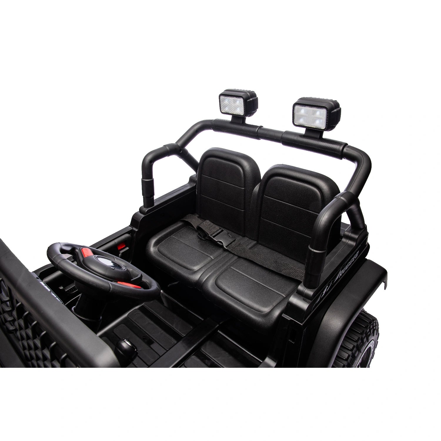 Close-up of black 12V Jeep-style ride-on toy car interior with two seats, safety belt, steering wheel, and off-road lights.