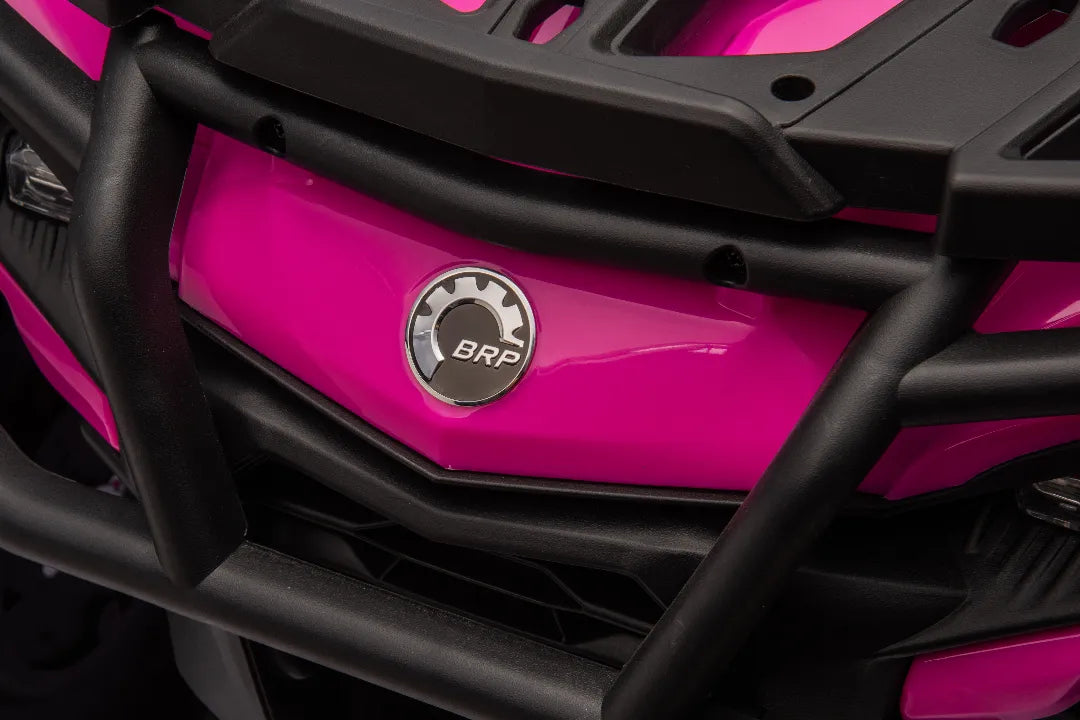 Close-up of pink Can-Am Outlander Monster ride-on quad front with black protective bumper and BRP logo badge visible