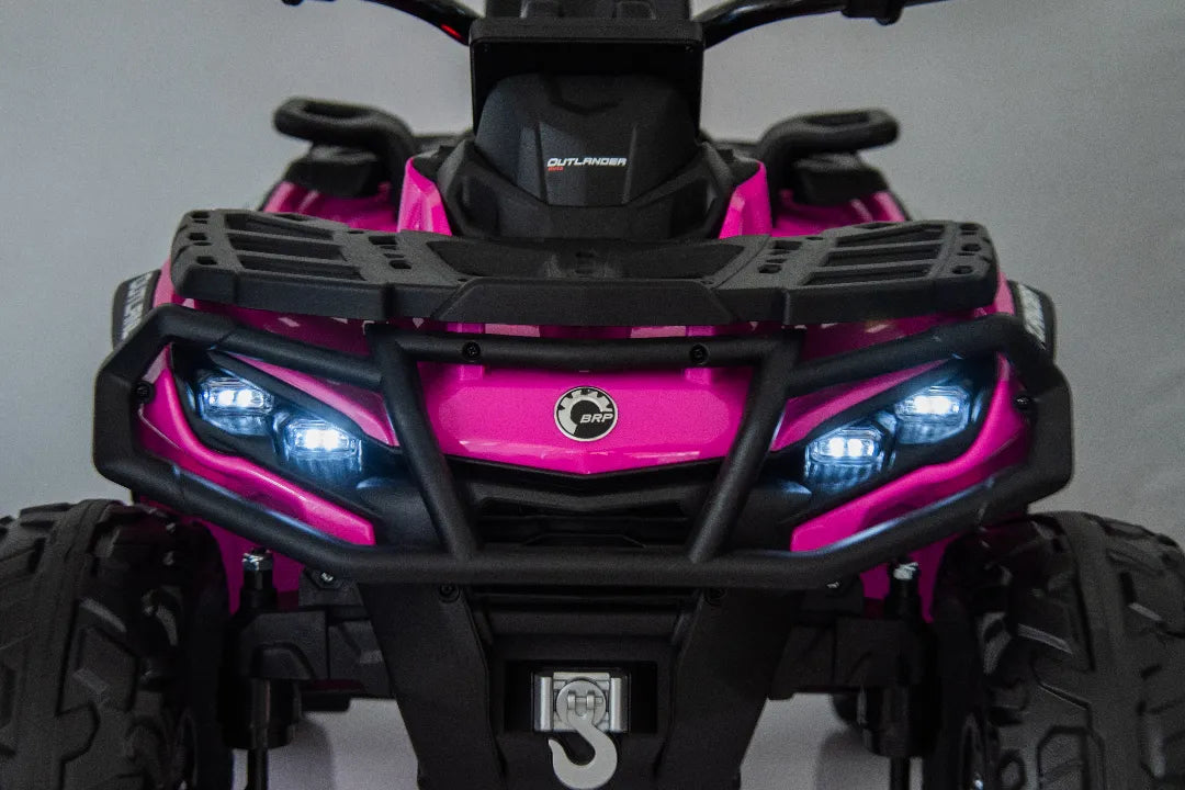 Front close-up of licensed Barbie pink 24V Can-Am Outlander Monster 2-seater ride-on quad with LED headlights and rugged tires