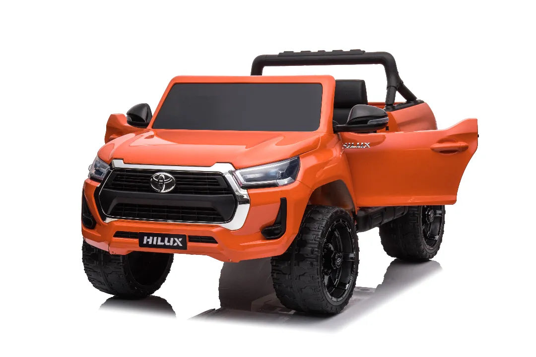 Orange 24V licensed Toyota Hilux SR5 4x2 kids ride-on ute with open door and realistic front grille design