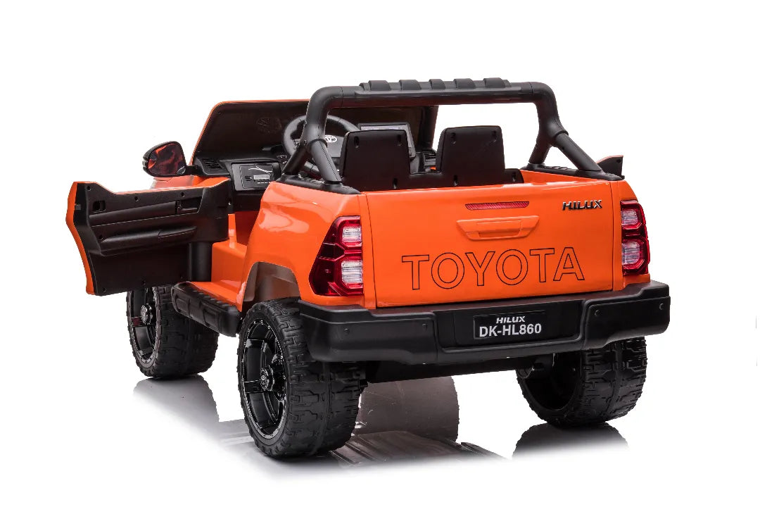 Rear view of orange 24V licensed Toyota Hilux SR5 4x2 kids ride-on ute with open door and two black seats