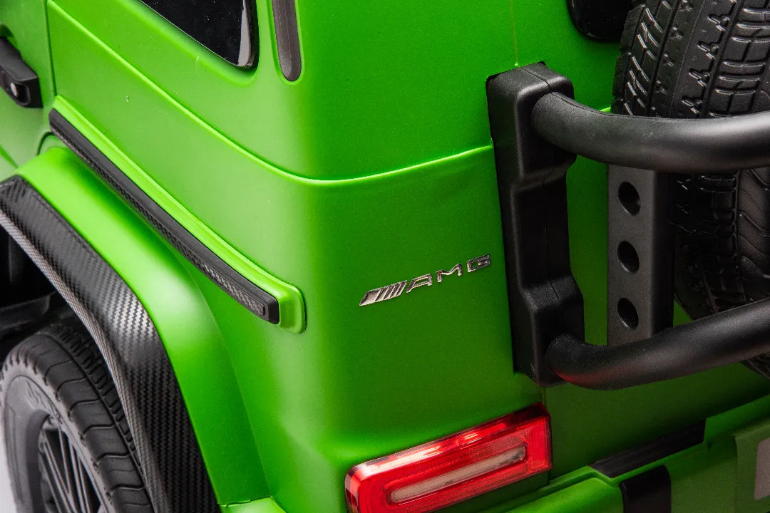 Close-up of green 24V 14Ah licensed Mercedes-AMG G63 ride-on car showing AMG badge and rear tail light details