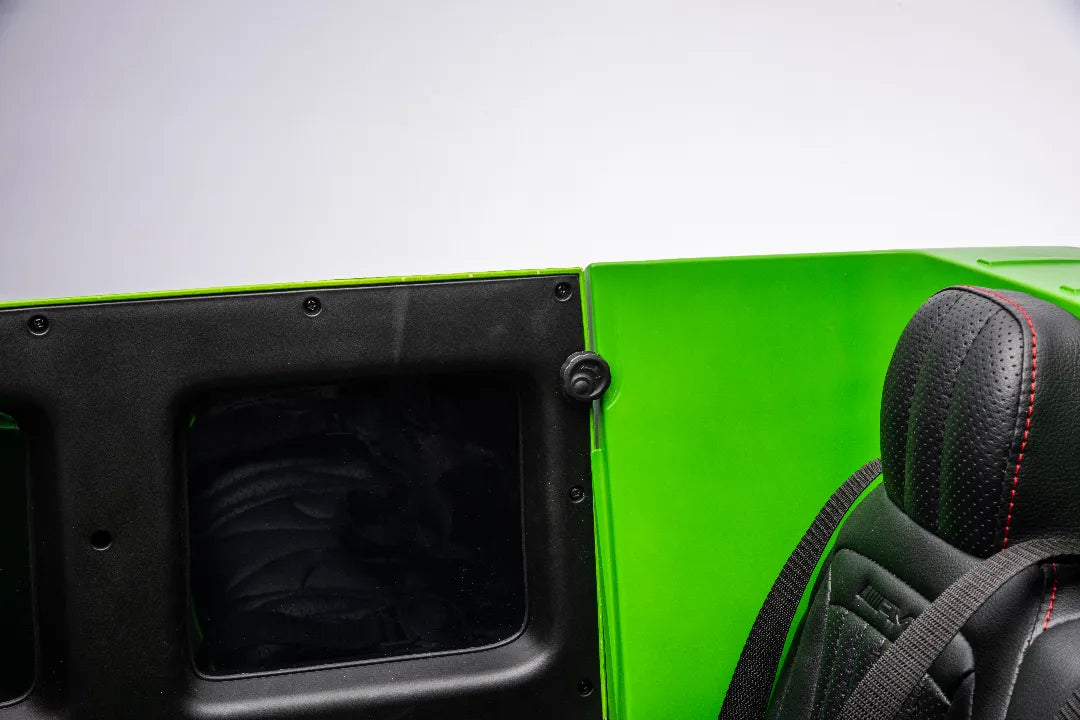 Close-up of black leather seat with red stitching and green exterior door panel of kids 24V Mercedes-AMG G63 ride-on car