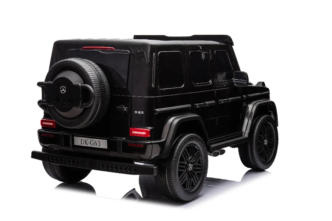Rear view of black 24V 14Ah licensed Mercedes-AMG G63 800W 4x4 kids ride-on car with spare tire detail