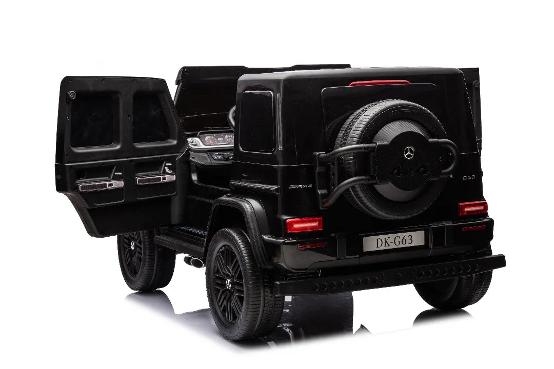 Rear view of black 24V 14Ah licensed Mercedes-AMG G63 kids ride-on car with open door and spare tire on back