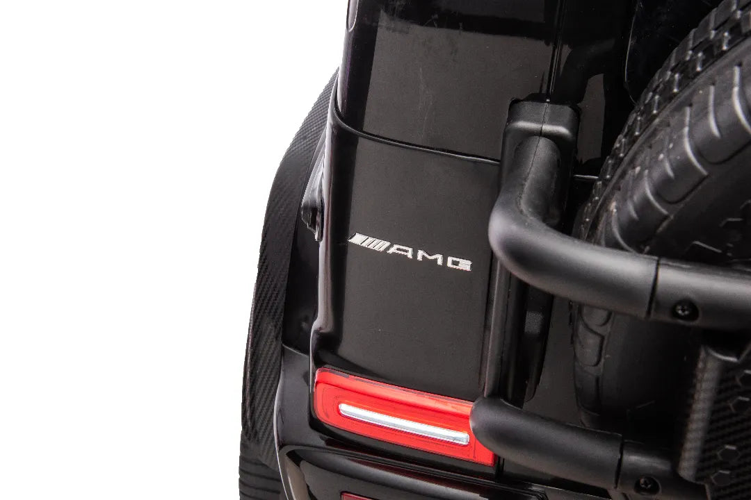 Close-up of rear black Mercedes-AMG G63 24V 14Ah kids ride-on car with AMG badge and red tail light detail