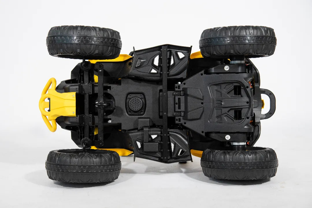 Underside view of yellow 24V Can-Am Renegade ride-on ATV quad bike showing black chassis and large off-road tires