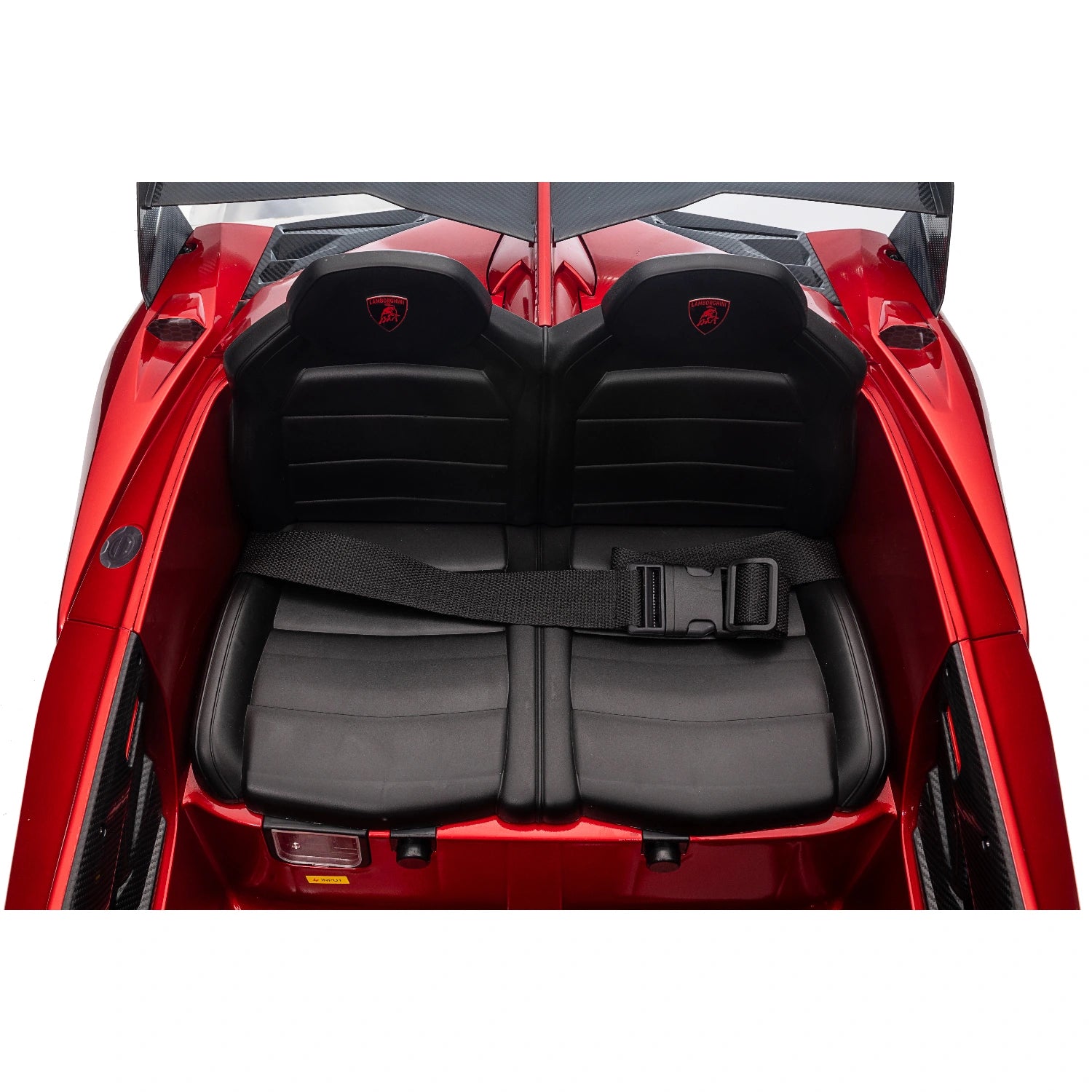 Close-up of black leather seats with safety belt in red licensed Lamborghini Veneno 12V ride-on car for kids